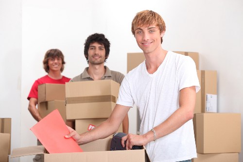Packed office boxes and furniture ready for transport